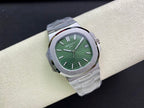 Patek Philippe watch with green dial, silver bezel, and metal bracelet, three-quarter view