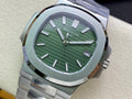 Patek Philippe watch with green dial, silver bezel, and brushed metal bracelet close-up