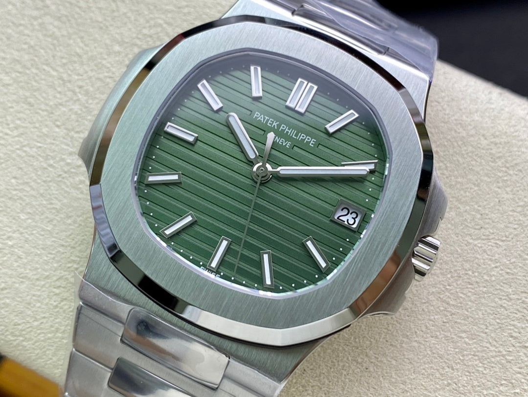 Patek Philippe watch with green dial, silver bezel, and brushed metal bracelet close-up