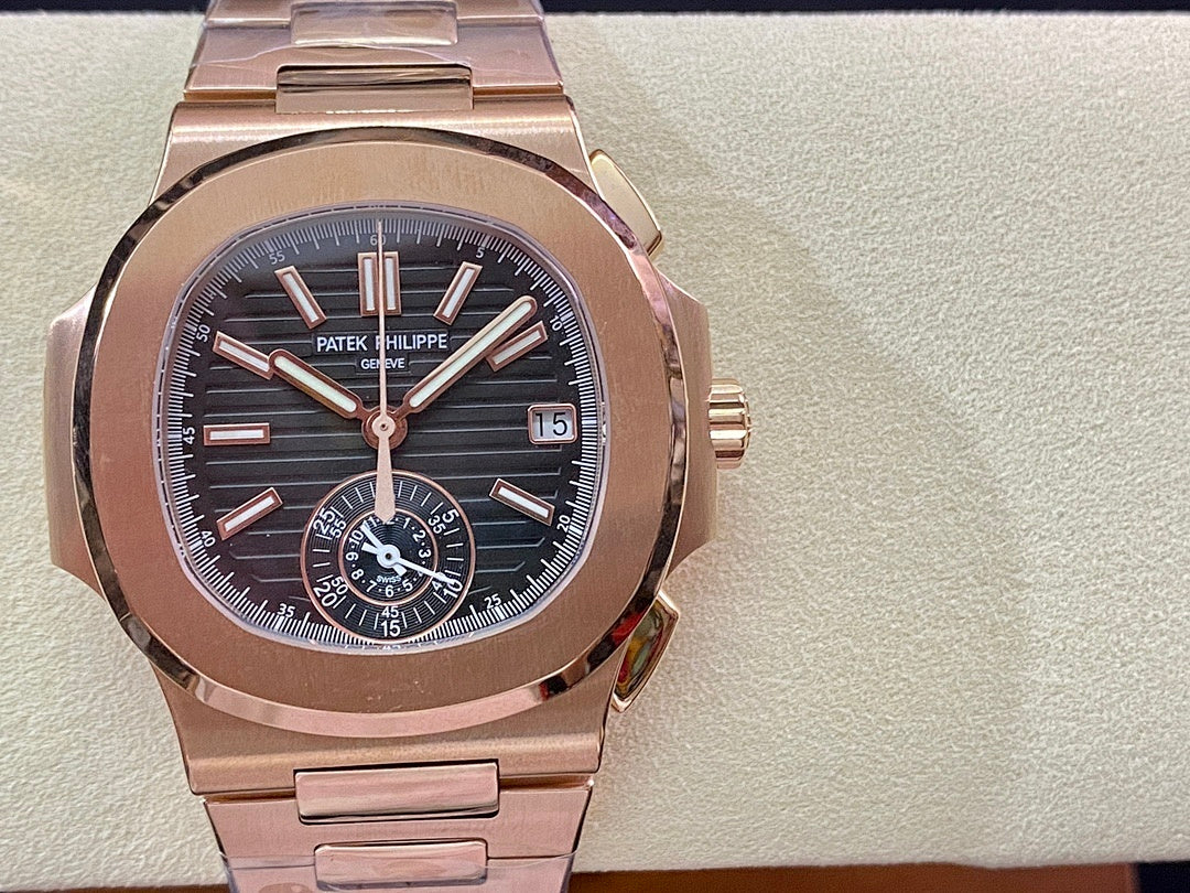 Rose-gold wristwatch with blue dial, baton hands, three subdials and date window