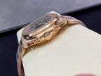 Rose-gold wristwatch with visible crown and side of case on display