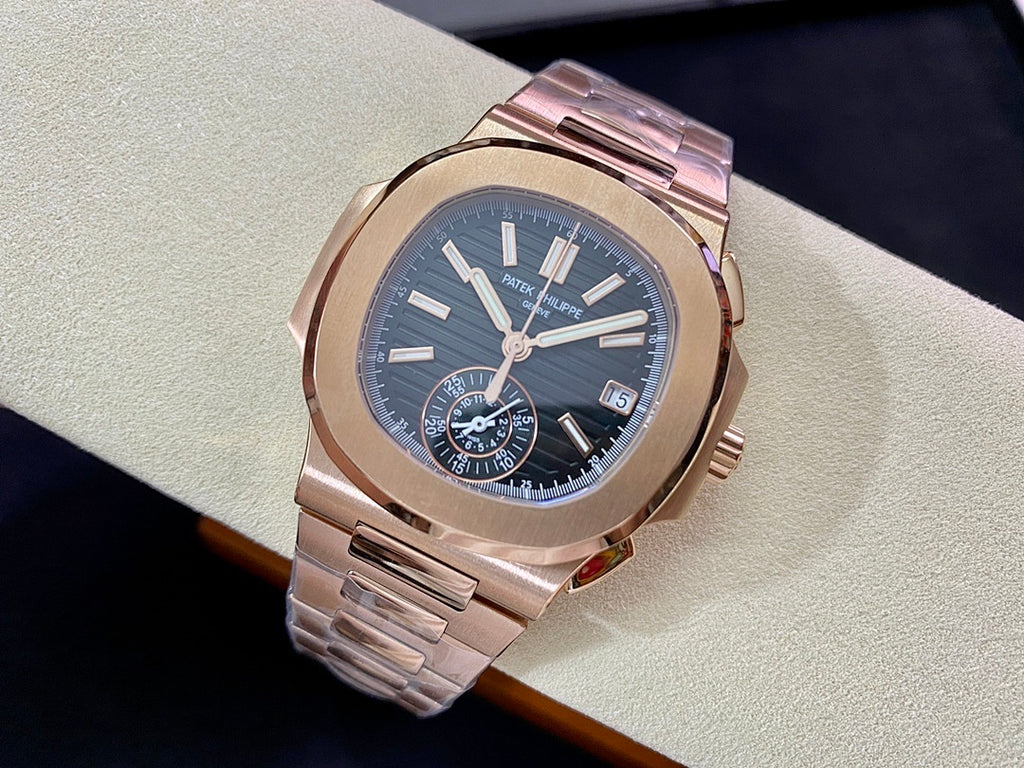 Rose-gold wristwatch on display with blue dial, baton markers, and subdials