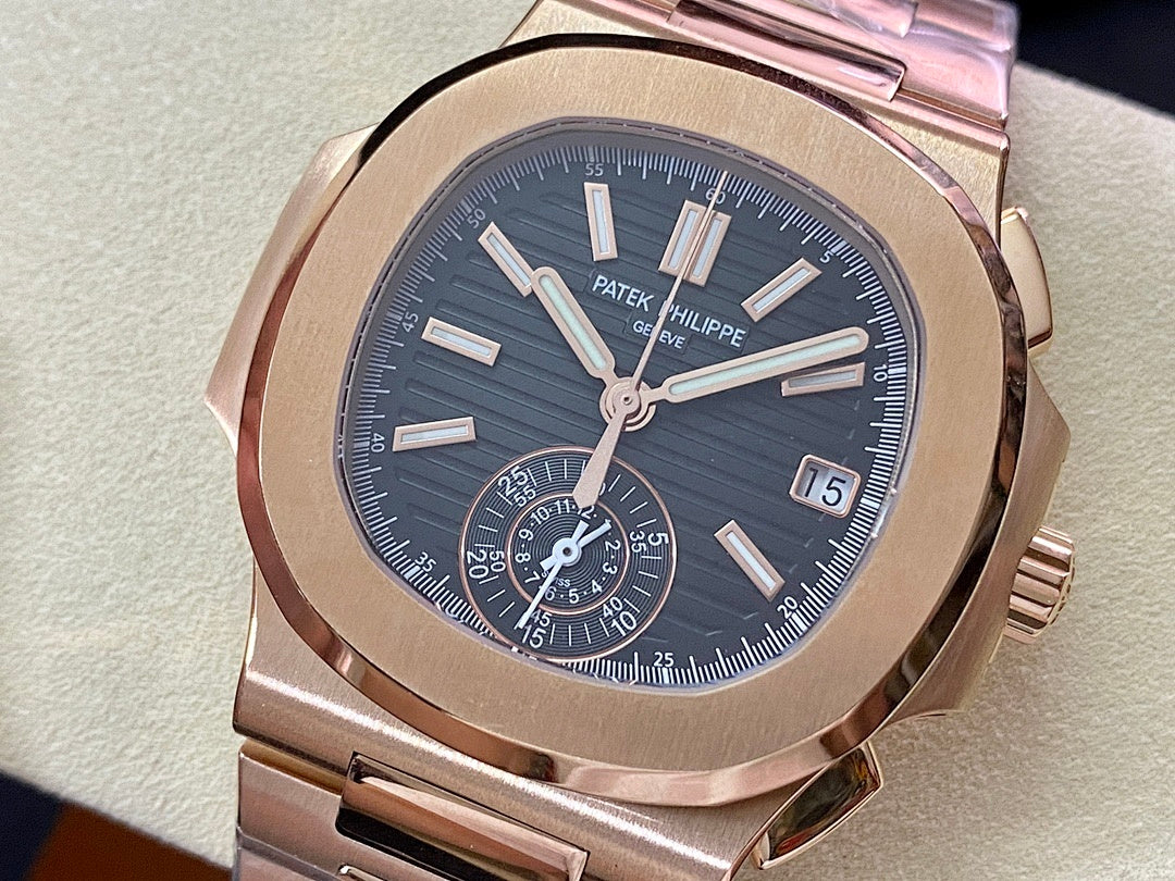 Patek Philippe rose-gold wristwatch with blue dial, baton markers, date window