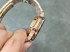 Patek Philippe watch underside with rose-gold tone bracelet links and clasp