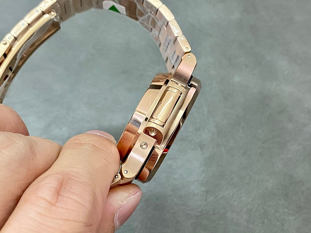 Patek Philippe watch underside with rose-gold tone bracelet links and clasp