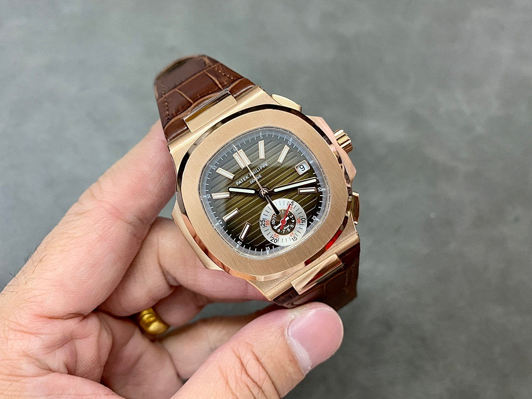 Rose-gold sport watch with olive dial and brown leather strap, angled view