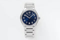 Stainless steel wristwatch with blue dial, diamond bezel, and metal bracelet