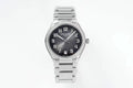 Diamond bezel steel wristwatch with dark dial, date window at 5 o'clock, metal bracelet