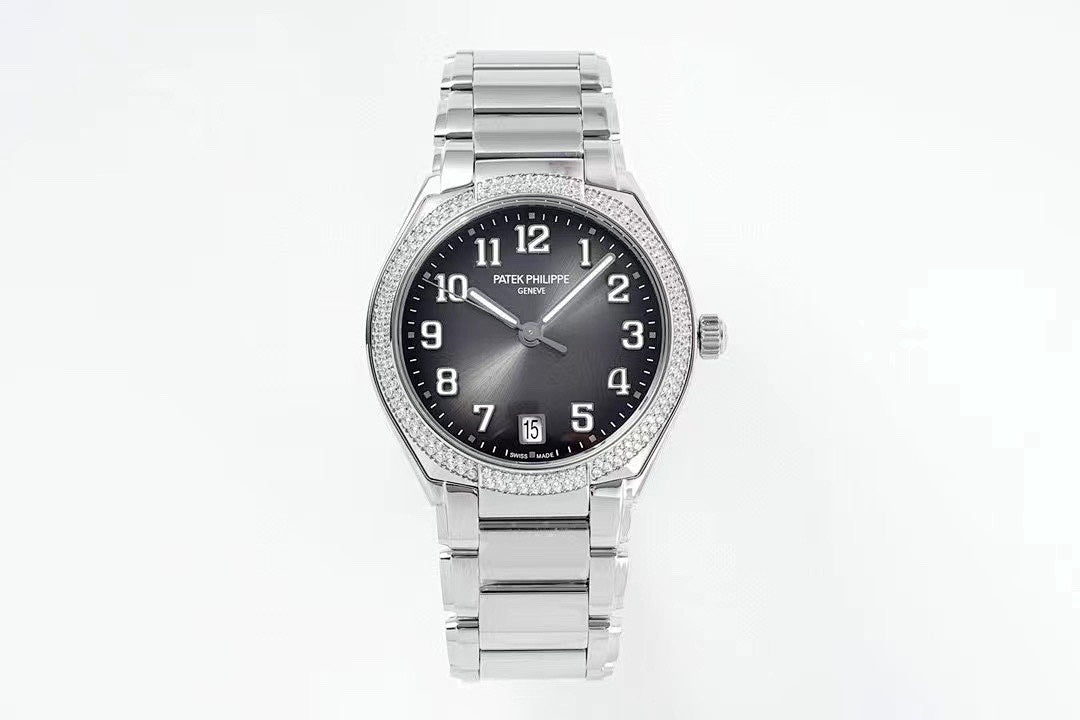 Diamond bezel steel wristwatch with dark dial, date window at 5 o'clock, metal bracelet