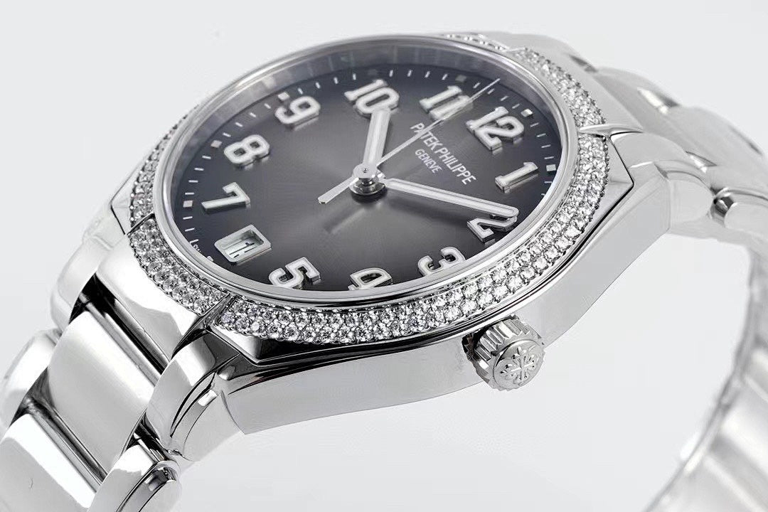 Diamond bezel steel wristwatch with black dial, large Arabic numerals, crown at 3 o'clock