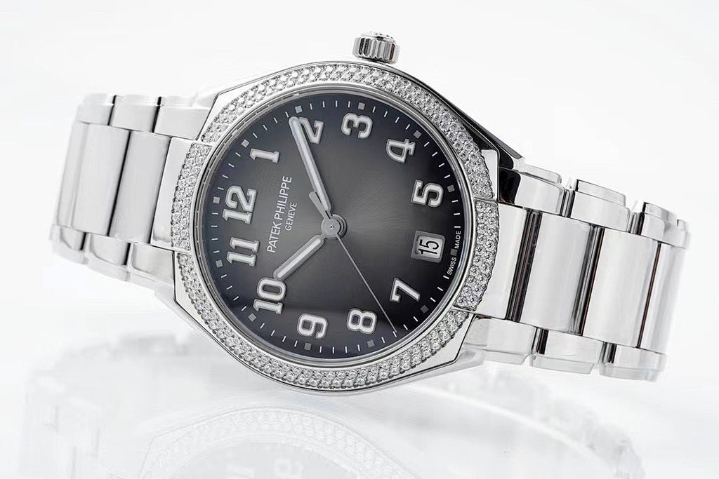 Diamond bezel steel wristwatch with black dial, Arabic numerals, and date window at 5