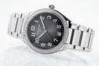 Diamond bezel steel wristwatch with black dial, Arabic numerals, and date window at 5