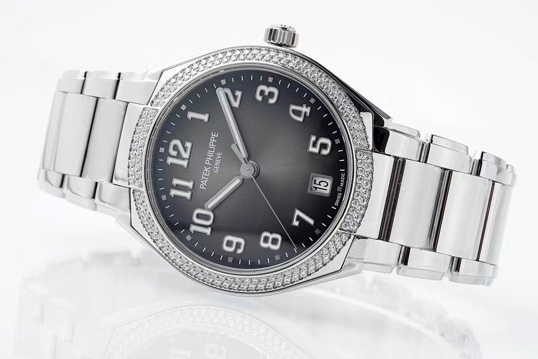Diamond bezel steel wristwatch with black dial, Arabic numerals, and date window at 5