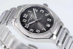 Diamond bezel steel wristwatch close-up with black textured dial, Arabic hour markers