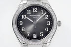 Diamond bezel steel wristwatch front close-up with dark dial and date window at 5