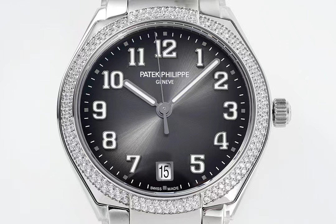Diamond bezel steel wristwatch front close-up with dark dial and date window at 5