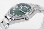 Men's steel wristwatch with green dial, diamond bezel, and crown detail