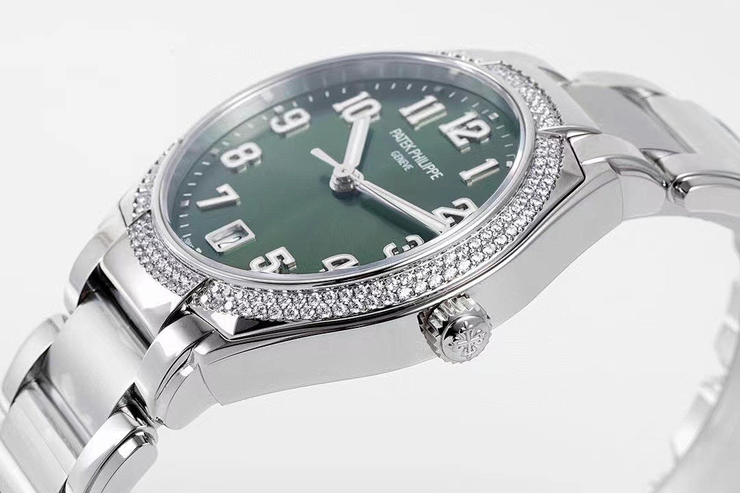 Men's steel wristwatch with green dial, diamond bezel, and crown detail
