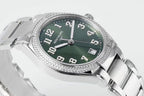 Men's steel wristwatch with green dial, diamond bezel, and baton hands