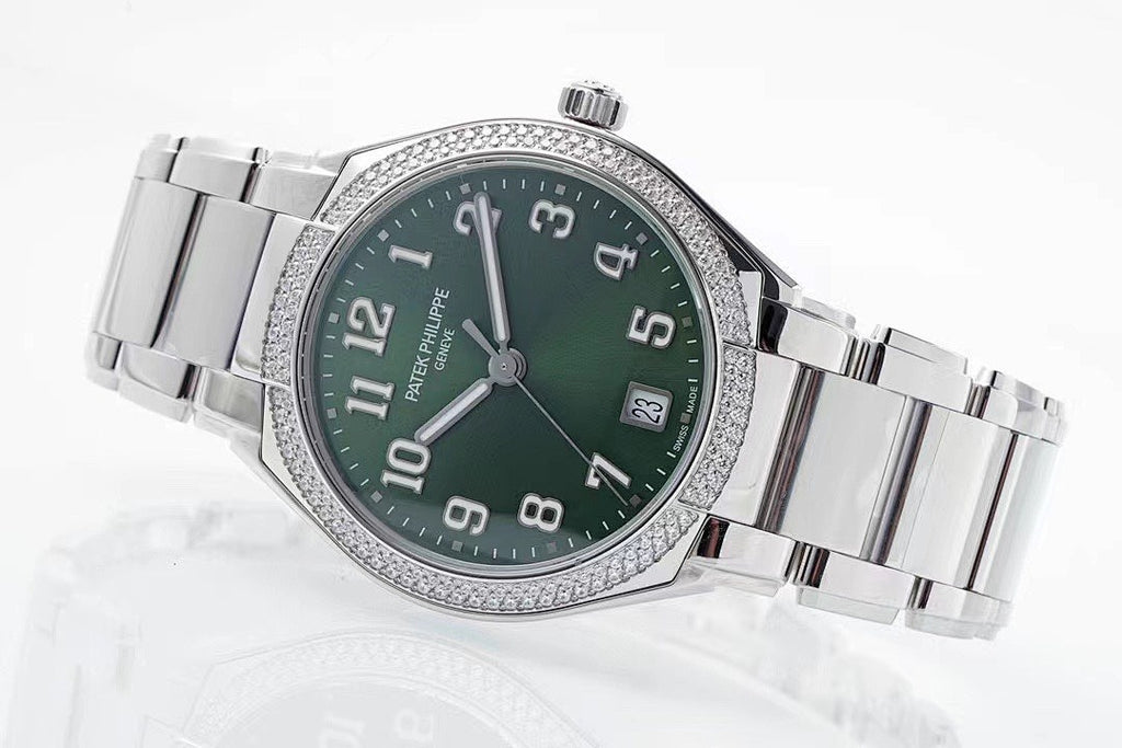 Men's steel wristwatch with green dial, diamond bezel, and metal bracelet