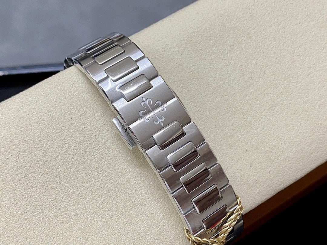Stainless steel watch clasp and bracelet links on a wristwatch band