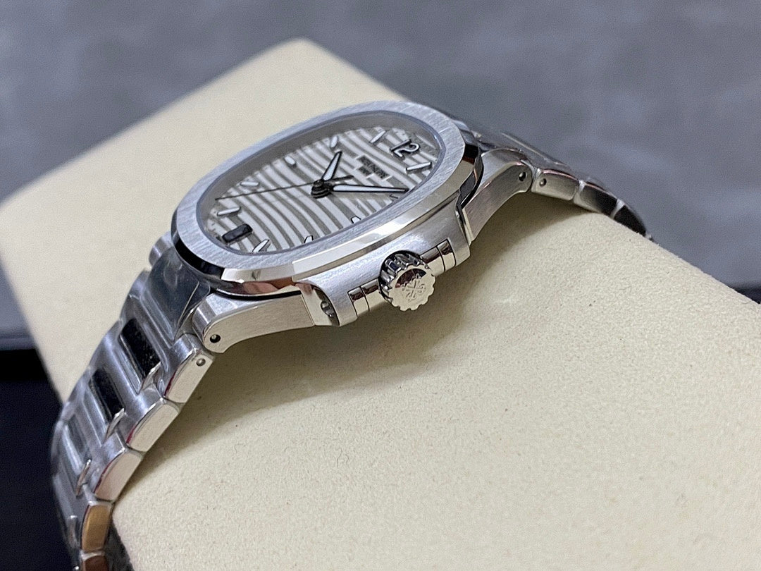 Stainless steel wristwatch with silver dial and crown side detail