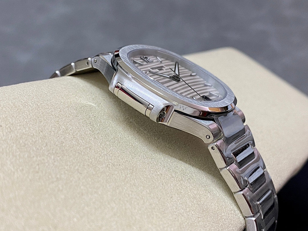 Stainless steel wristwatch with silver dial and textured bezel