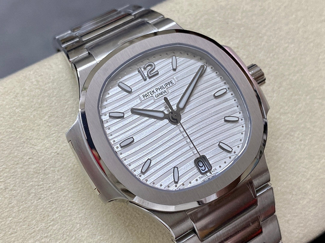 Stainless steel wristwatch with silver striped dial and hour markers