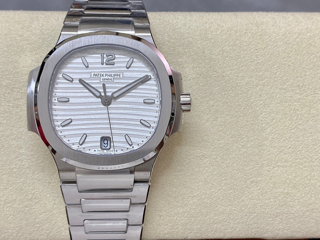 Stainless steel wristwatch with silver dial, metal bracelet, and hands