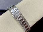 Metal watch bracelet with polished links and engraved center panel