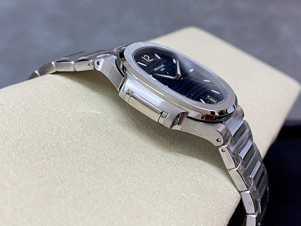 Steel wristwatch case and bracelet with blue dial and crown detail
