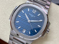 Patek Philippe steel wristwatch with blue dial, silver hands, and date window