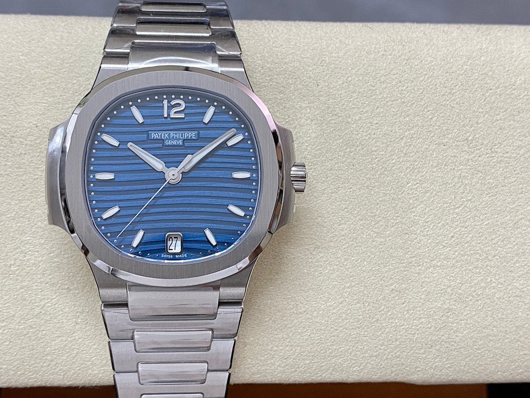 Blue dial steel wristwatch with silver hands, baton markers, and date window