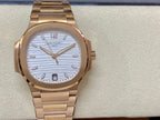 Patek Philippe wristwatch on band with gold-tone links and light blue striped face, large indices