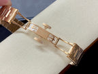 Patek Philippe wristwatch clasp and links in gold-tone metal, open bracelet view