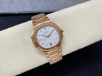 Patek Philippe wristwatch with gold-tone bracelet and light blue striped dial, minimalist hands