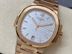Patek Philippe wristwatch with gold-tone bracelet and light blue striped dial, round case