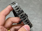Patek Philippe watch bracelet links and clasp metal, hand holding