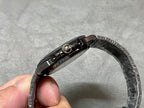 Patek Philippe watch bracelet clasp and textured links metal, side view