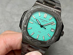 Patek Philippe watch turquoise dial black textured case metal bracelet