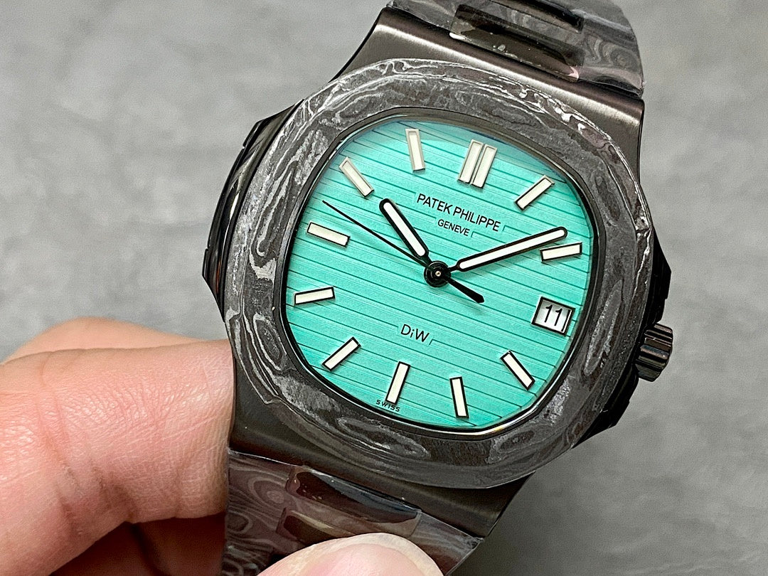 Patek Philippe watch turquoise dial black textured case metal bracelet