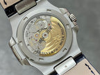 Patek Philippe watch caseback with gold-toned movement and engraved text