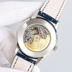 Patek Philippe watch case with exposed gold-toned movement and navy leather strap