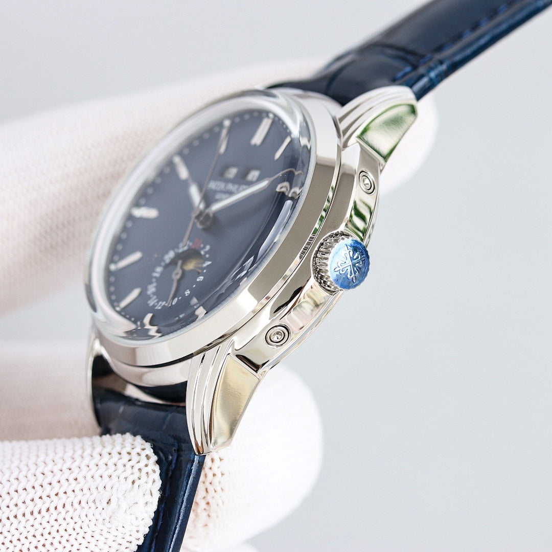 Patek Philippe watch with blue dial, silver case, and navy leather strap, side profile