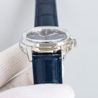 Patek Philippe watch with silver case and navy leather strap, crown on side