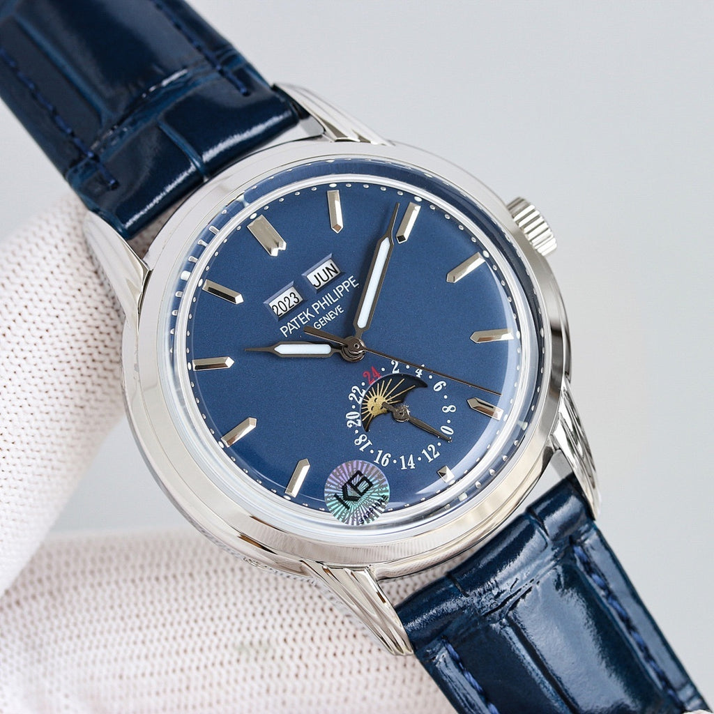 Patek Philippe watch front view with blue dial, silver case, and navy leather strap