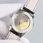 Patek Philippe wristwatch with visible movement, black leather strap, silver case