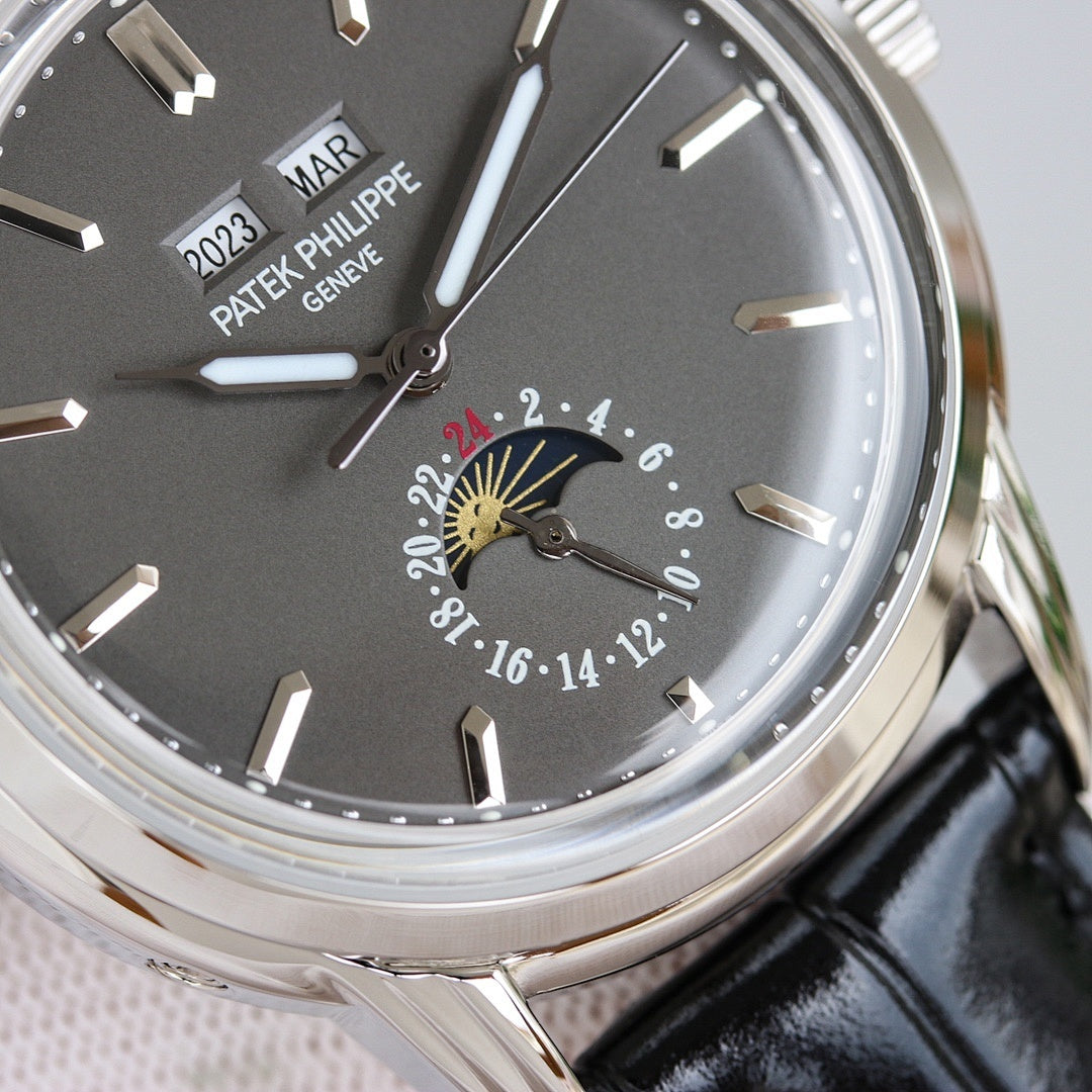 Patek Philippe wristwatch close-up: black dial with luminous markers and subdial