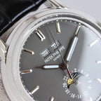 Patek Philippe wristwatch close-up of black dial markers and dual hands