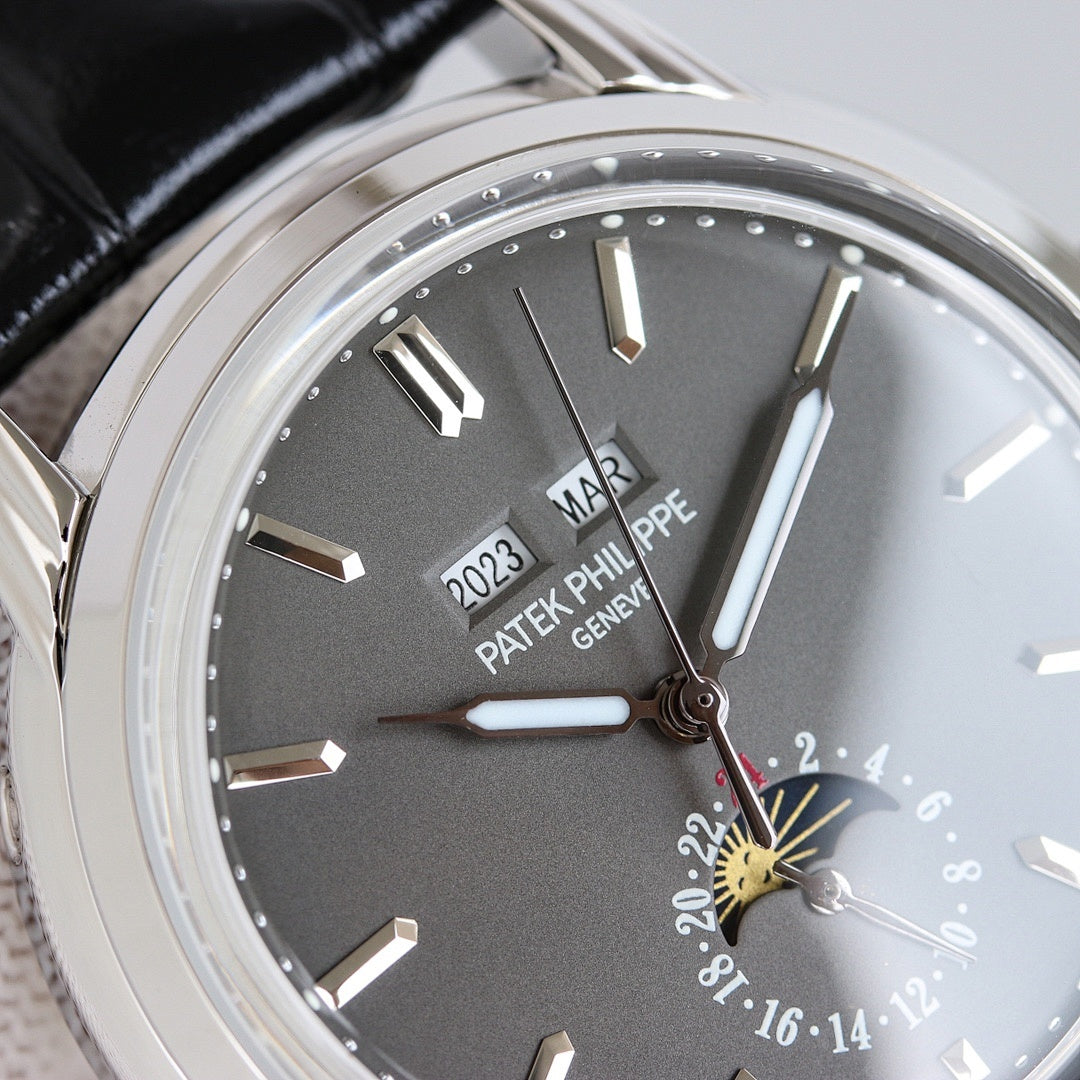 Patek Philippe wristwatch close-up of black dial markers and dual hands